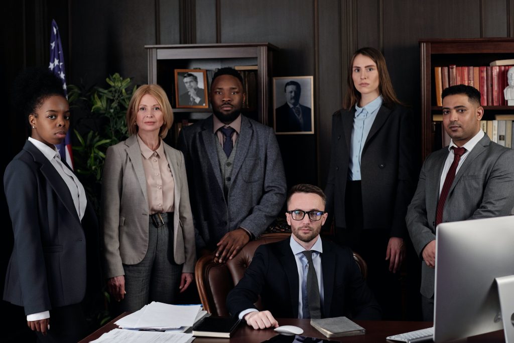 A group photo of a legal team. Photo by August de Richelieu @ Pexels.com