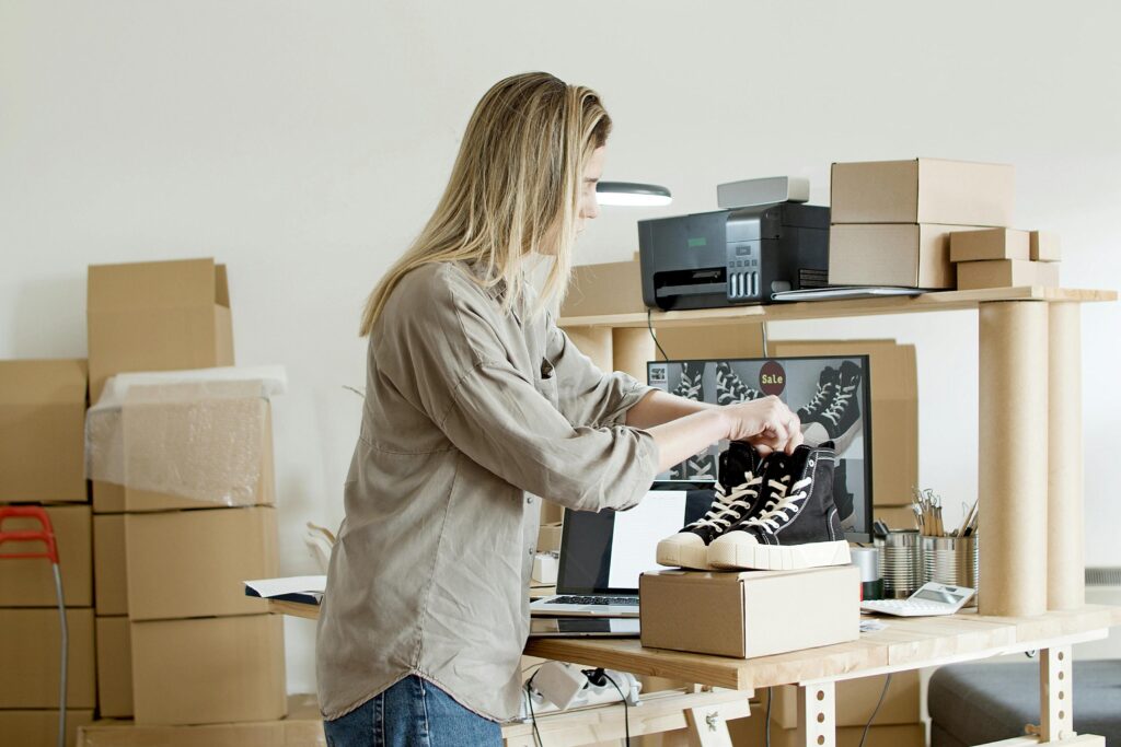 woman packing online ecommerce shoe purchase